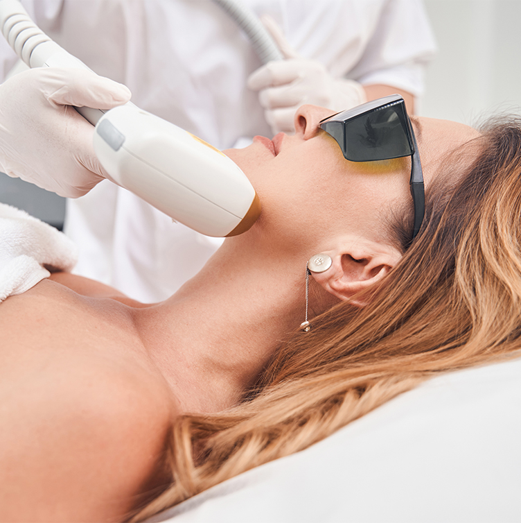 Patient receiving a Sciton laser skin treatment at Olympia Aesthetics and Wellness