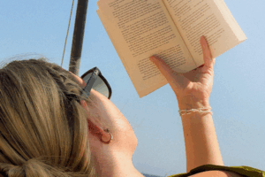 olympia aesthetics in palm harbor fl Woman's face partially shaded by hair, illustrating the need to prevent skin cancer through sun protection.