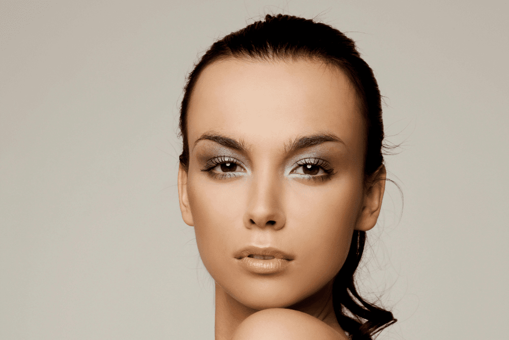 Close-up of a woman's healthy, clear skin, showing the regenerative effects of Exosomes and Polynucleotides.
